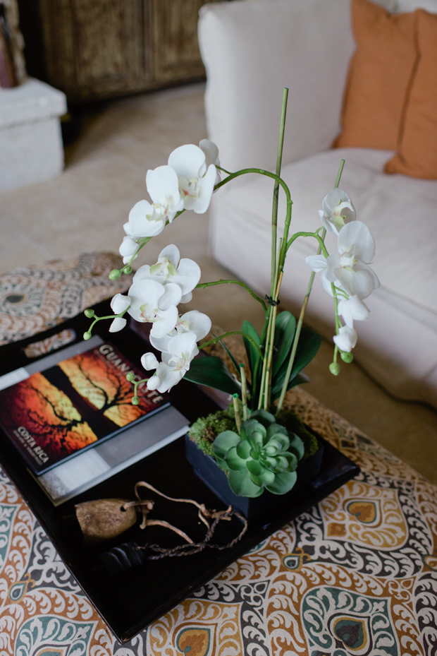 silk orchid arrangement on tray